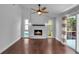 Spacious living room with fireplace and sliding door with access to the exterior at 7 Georgia Ave, Crystal Beach, FL 34681