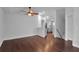 Open floor plan with hardwood flooring, a kitchen view, and ample natural light at 7 Georgia Ave, Crystal Beach, FL 34681