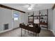Cozy office space features wood-like floors, custom shelving, and a modern desk at 7 Georgia Ave, Crystal Beach, FL 34681
