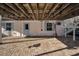 Covered patio with brick flooring, white siding, and staircase at 7 Georgia Ave, Crystal Beach, FL 34681