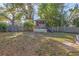 Fenced backyard with grassy area and play structure at 7465 15Th N St, St Petersburg, FL 33702