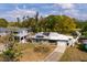Aerial shot of a home with solar panels on its roof near a body of water at 8001 Orient Ne Way, St Petersburg, FL 33702