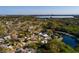Beautiful aerial view of the property in a serene, lakeside neighborhood surrounded by lush greenery at 8001 Orient Ne Way, St Petersburg, FL 33702