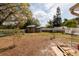 A big backyard with shed and view of a treeline at 8001 Orient Ne Way, St Petersburg, FL 33702