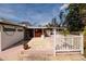 Backyard featuring a white fence, a patio, and a well-maintained yard at 8001 Orient Ne Way, St Petersburg, FL 33702