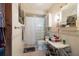 Bathroom boasts a glass-block shower and white fixtures, complemented by tile walls at 8001 Orient Ne Way, St Petersburg, FL 33702