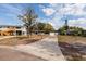 Charming single-Gathering home with an attached one car garage on a large grassy lot and mature landscaping at 8001 Orient Ne Way, St Petersburg, FL 33702
