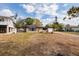 Quaint house with attached one car garage on a large grassy lot and mature landscaping at 8001 Orient Ne Way, St Petersburg, FL 33702