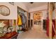 Hallway featuring an arched doorway, closet, and tile floors leading into the kitchen at 8001 Orient Ne Way, St Petersburg, FL 33702