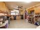 Open kitchen layout with tile floors, wood cabinets, and a window overlooking a seating area at 8001 Orient Ne Way, St Petersburg, FL 33702