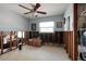 Room with window and ceiling fan, filled with boxes and ready for renovation at 8001 Orient Ne Way, St Petersburg, FL 33702
