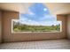 Balcony with decorative archway providing a picturesque view of lush greenery and blue skies at 812 Point Seaside Dr, Crystal Beach, FL 34681