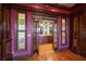 Elegant entrance featuring ornate stained glass windows and hardwood floors, leading to a bar area at 812 Point Seaside Dr, Crystal Beach, FL 34681