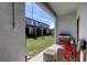 Relaxing outdoor patio area with a grill, wicker furniture and views of the backyard at 8294 Corner Pine Way, New Port Richey, FL 34655