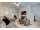 Open living room featuring tile floors, a ceiling fan, a TV, and comfortable seating at 8294 Corner Pine Way, New Port Richey, FL 34655