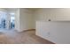 Loft area with neutral carpet, closet, and view into a bedroom at 8294 Corner Pine Way, New Port Richey, FL 34655