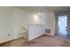 Bright loft area featuring neutral carpet, staircase, and an open layout, perfect for relaxation at 8294 Corner Pine Way, New Port Richey, FL 34655