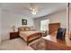 Cozy bedroom with classic wooden furniture and warm natural light at 8421 Pine River Rd, Tampa, FL 33637