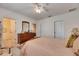 Spacious bedroom featuring a window, closet, and an open doorway to the Primary bath at 8421 Pine River Rd, Tampa, FL 33637
