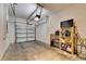 Spacious garage with an open door and storage shelving against the concrete block wall at 8421 Pine River Rd, Tampa, FL 33637