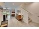 Spacious hallway leading to the dining and living areas, featuring neutral walls and tile flooring at 8421 Pine River Rd, Tampa, FL 33637