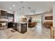 Open-concept kitchen with a breakfast bar seamlessly connecting to the living and dining areas at 8421 Pine River Rd, Tampa, FL 33637