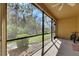 Enclosed patio with a view of the yard, a bicycle, and a rug at 8421 Pine River Rd, Tampa, FL 33637