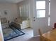 Cozy living room area with comfortable seating, a patterned rug, and access to the kitchen at 8525 111Th St # 210, Seminole, FL 33772