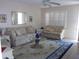 Inviting living room with lots of natural light, neutral tones and comfortable seating at 8525 111Th St # 210, Seminole, FL 33772