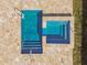Aerial view of pool and hot tub with stone tile surround at 8887 Little Bluestem Dr, Land O Lakes, FL 34637