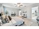 Primary bedroom with large windows and access to the en suite bathroom at 8887 Little Bluestem Dr, Land O Lakes, FL 34637