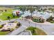 Stunning community center featuring colorful facades, manicured landscaping, and a lovely water fountain entrance at 8887 Little Bluestem Dr, Land O Lakes, FL 34637