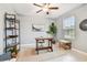 Well-lit home office with a neutral color scheme and ample space for productivity at 8887 Little Bluestem Dr, Land O Lakes, FL 34637