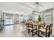 Bright open-plan space featuring dining, living areas, and patio access for indoor-outdoor living at 8887 Little Bluestem Dr, Land O Lakes, FL 34637