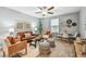 Upstairs living room offering comfortable seating, modern decor, and bright natural light at 8887 Little Bluestem Dr, Land O Lakes, FL 34637