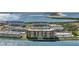 Aerial view of the condo building on the water featuring beautiful water views and nearby parking at 9 Haig Pl # 310, Dunedin, FL 34698