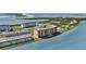 Aerial view showing the condo buildings on the water featuring a picturesque, serene setting at 9 Haig Pl # 310, Dunedin, FL 34698