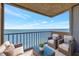 Relaxing balcony with comfortable seating, perfect for enjoying the beautiful waterfront views at 9 Haig Pl # 310, Dunedin, FL 34698
