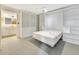 Cozy bedroom with a wall bed, white built-ins, and a ceiling fan at 9 Haig Pl # 310, Dunedin, FL 34698