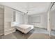 Compact bedroom is bright and has built-ins, murphy bed and carpet at 9 Haig Pl # 310, Dunedin, FL 34698