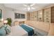 Inviting bedroom with bright window and well-placed desk area, completed with ample storage at 9 Haig Pl # 310, Dunedin, FL 34698