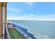 Stunning water view from a balcony featuring coastal landscaping, and sunny skies at 9 Haig Pl # 310, Dunedin, FL 34698