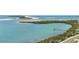 Beautiful waterfront view featuring boat docks with lush mangrove habitats along the shoreline at 9 Haig Pl # 310, Dunedin, FL 34698