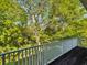 Balcony with trees in the background at 920 E Lake Dr, Tarpon Springs, FL 34688
