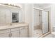 Clean bathroom featuring a single sink vanity, toilet, and glass enclosed shower at 920 E Lake Dr, Tarpon Springs, FL 34688