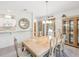 Bright dining room with a chandelier, neutral walls, and decorative cabinets for an elegant dining experience at 920 E Lake Dr, Tarpon Springs, FL 34688