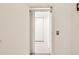 View of the interior of an elevator with white walls and an accordion style door at 920 E Lake Dr, Tarpon Springs, FL 34688