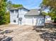 Striking two-story building with an attached two-car garage, offering ample space and modern amenities at 920 E Lake Dr, Tarpon Springs, FL 34688
