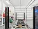 Well-equipped garage with multiple bays, lift, and work area for auto repairs and maintenance projects at 920 E Lake Dr, Tarpon Springs, FL 34688