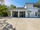 Garage exterior featuring open bay doors that lead into the spacious garage at 920 E Lake Dr, Tarpon Springs, FL 34688